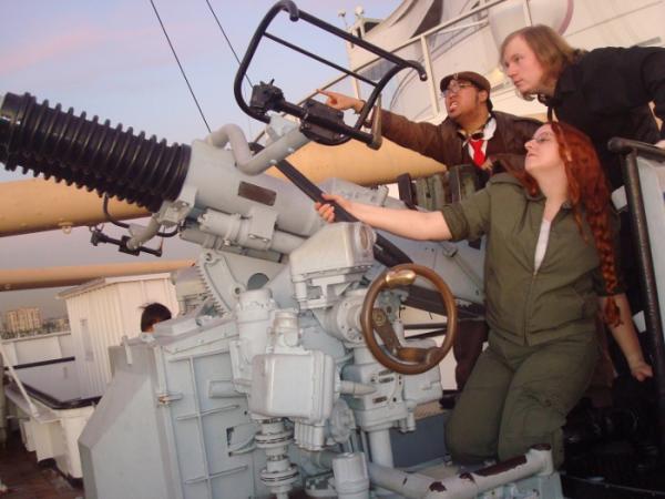 Seafaring adventure! How glorious! 
(Lokenthewolf, myself, and my friend MPsy manning the AA gun turret, HMS Queen Mary, Jan. 2009)