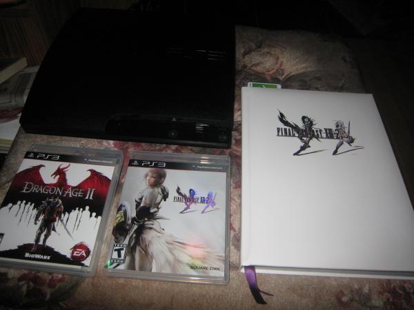 Just A Picture I Took Of My PS3, My First 2 PS3 Games(Dragon Age II & FFXIII-2) Accompanied By The Complete Official Guide Book Collectors Edition For FFXIII-2.